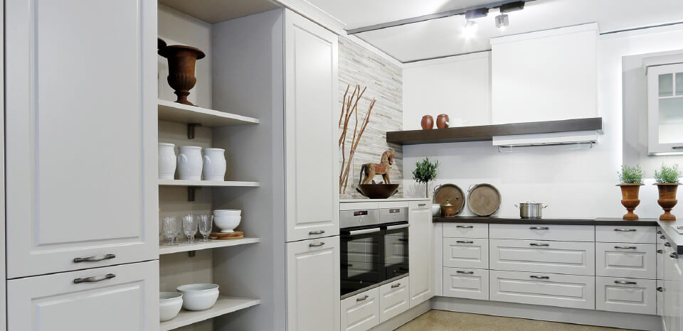 White kitchen decorated with wooden objects