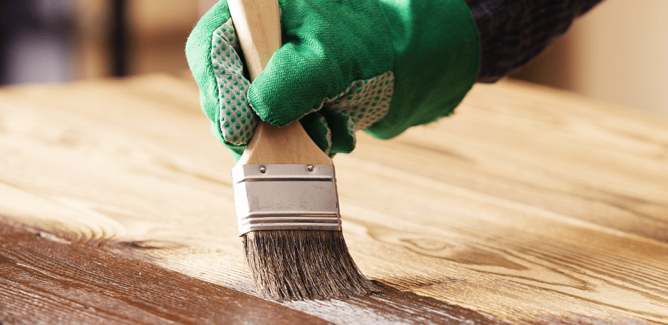 Applying wood putty to a wood surface
