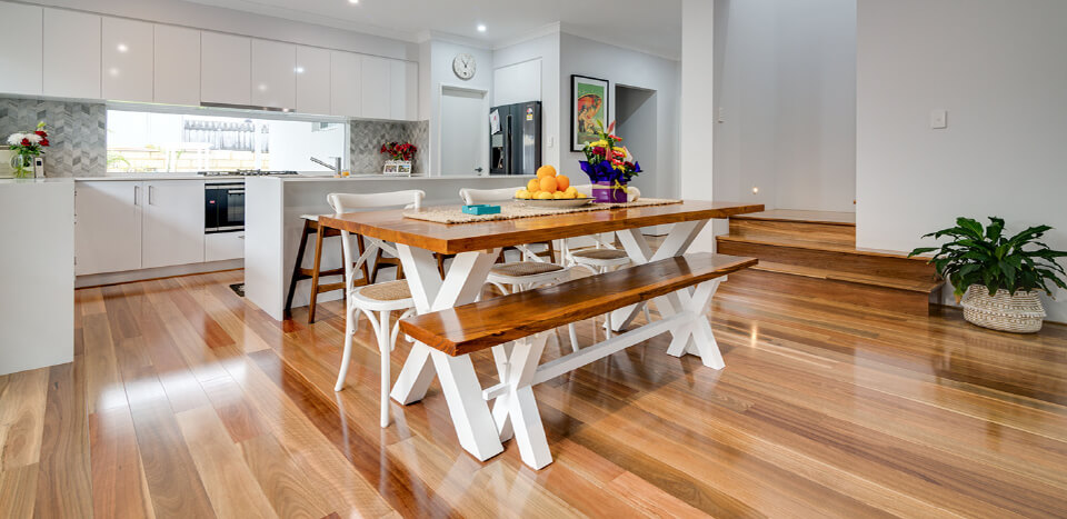 Wooden bench and wooden table on top of wooden flooring