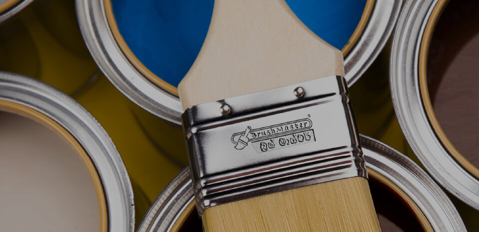 BrushMaster Paintbrush on top of some paint cans